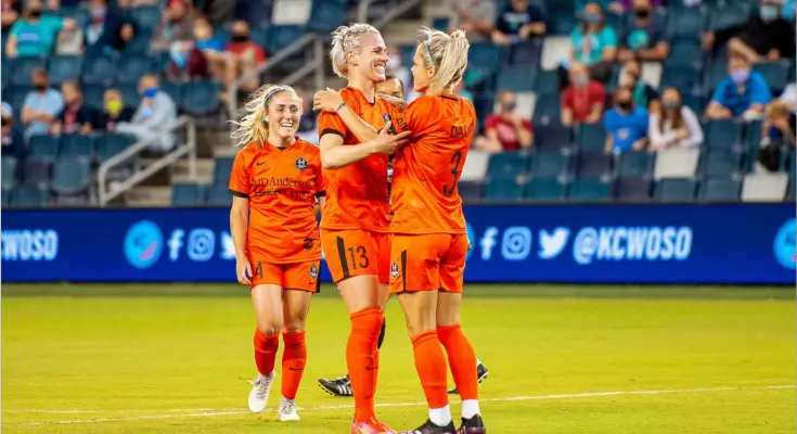 Rachel Daly and Sophie Schmidt celebrate during their 3-1 victory over KC NWSL. Photo from Twitter @HoustonDash