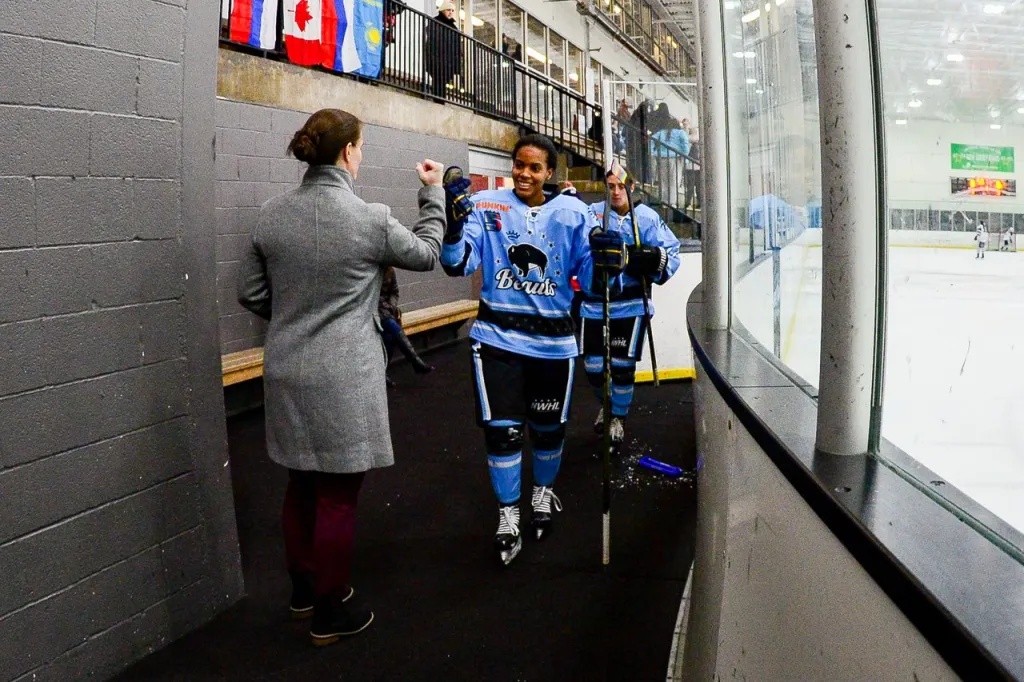 Mikyla Grant-Mentis gives a fist bump while leaving the ice in Buffalo.