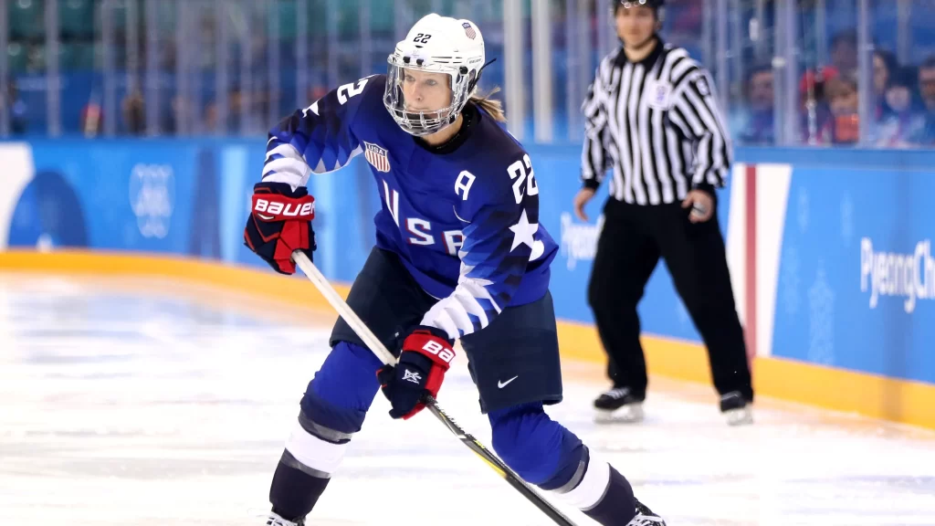 Kacey Bellamy, on ice with Team USA Women’s Hockey, prepares to take a shot. 